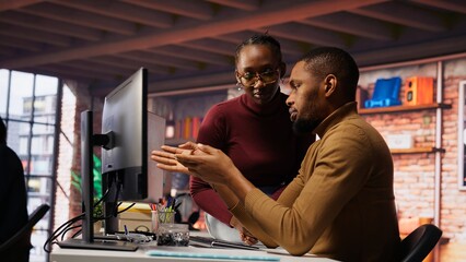 Team of startup admins doing brainstorming, working with machine learning tech advancing AI. Software development agency staff members transforming data into predictive models, camera B