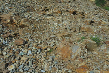 Stone mining, looks scattered with small rocks that have been processed from large rocks that come...