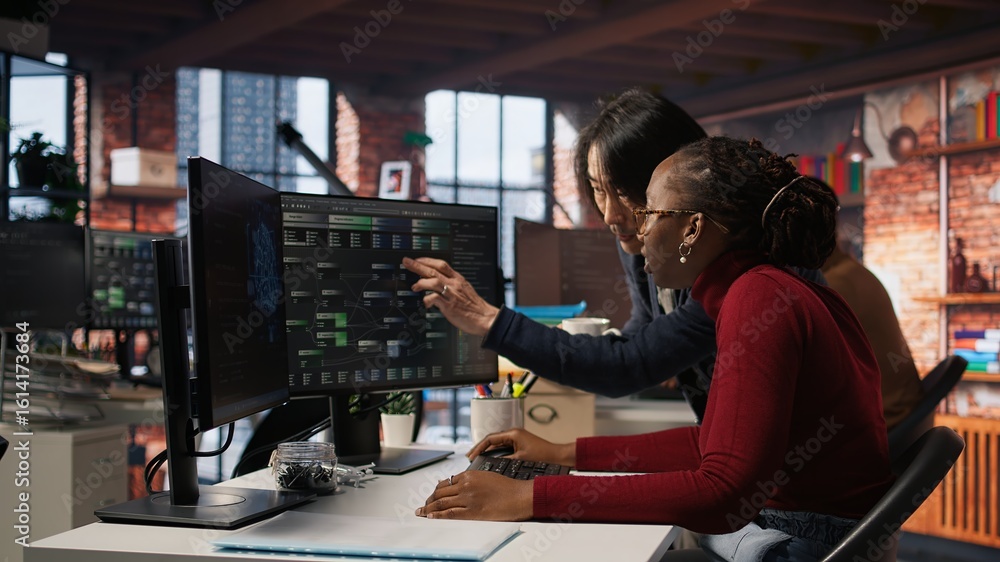 Poster exhausted ai startup employee rubbing forehead while analyzing datasets on computer, receiving coffe