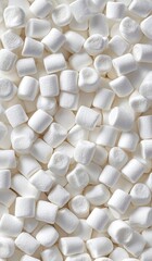 An overhead, clustered view of many fluffy, white marshmallows. Delicious and sweet treats