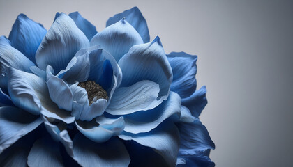a close up shot of a wilted grey blue flower its petals drooping and losing their vibrant color symbolizing failure and decay the background is a muted somber tone grey defeat
