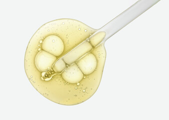 Liquid yellow-orange retinol or vitamin c gel or serum on a screen of microscope white isolated background
