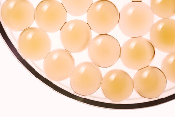 Yellow cosmetic ingredient liposomes collagen or vitamin c texture top view