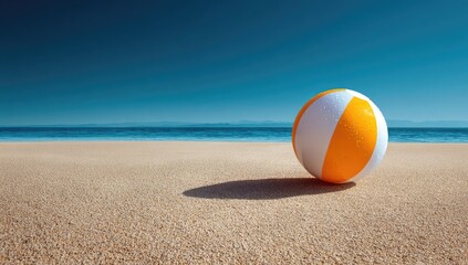 Beach ball on sandy shore, ocean background; summer vacation (3)