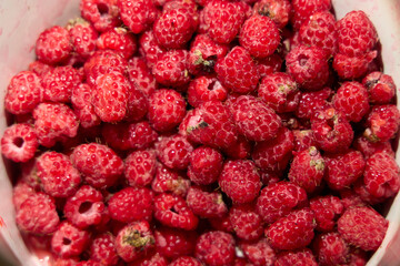 Fresh and Juicy Raspberries Carefully Arranged in a Basket for Your Enjoyment and Delight