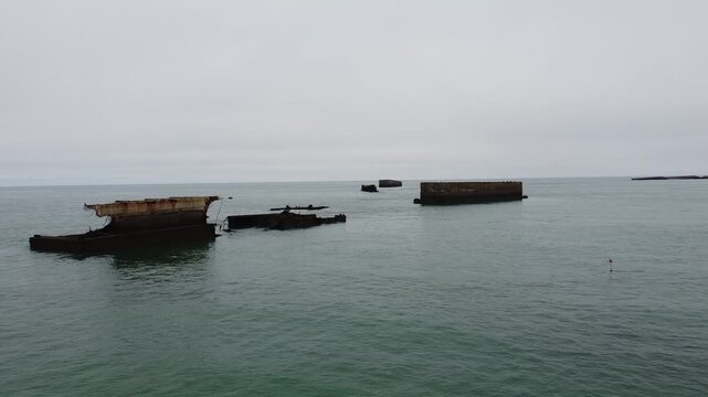 Remains of Mulberry Harbor B in Normandy, France. The remains of the artificial harbor are clearly visible at low tide.
