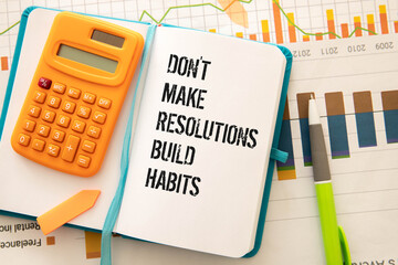 Wooden blocks with words 'Don't Make Resolutions Build Habits'