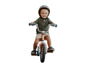 Joyful toddler boy wearing helmet rides a bicycle with a big smile, mastering balance and independence.