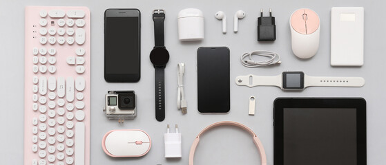 Composition with various modern gadgets on grey background