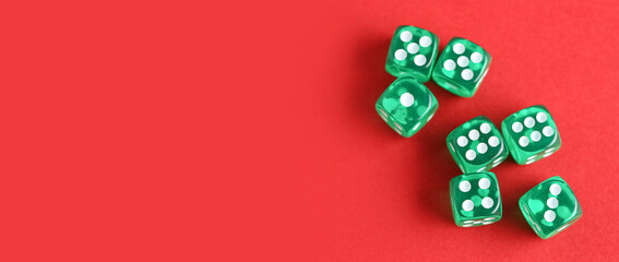 Many dices on red background with space for text