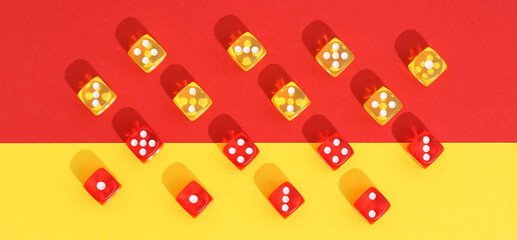 Many dices on color background, flat lay