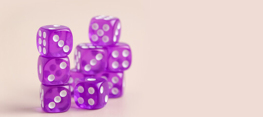 Many dices on beige background with space for text