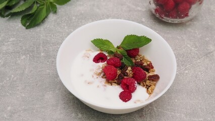 bowl with Greek yogurt homemade granola, mixed nuts, almond, cashew, hazelnut. Healthy vegetarian...
