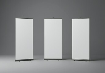 Three vertical blank roll-up banners on a neutral gray background, minimalist design, evoking a professional atmosphere, suitable for presentations.