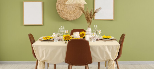 Table setting with sunflowers in dining room