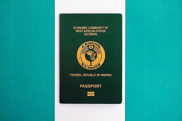 Nigerian passport on flag. The concept of citizenship
