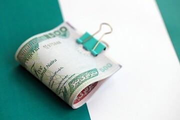 Nigerian naira currency money bills lies on flag. The concept of business and investment