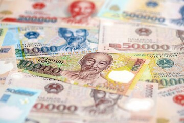 Vietnamese dong currency money bills. The current banknotes lies on table in big amount