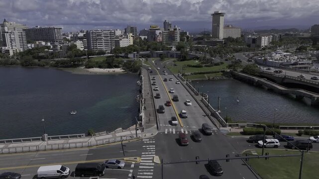 Drone flies over Puente Guillermo Esteves bridge on sunny morning in San Juan, Puerto Rico