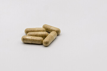 Natural Herbal Supplement Capsules on White Background for Health and Wellness Display