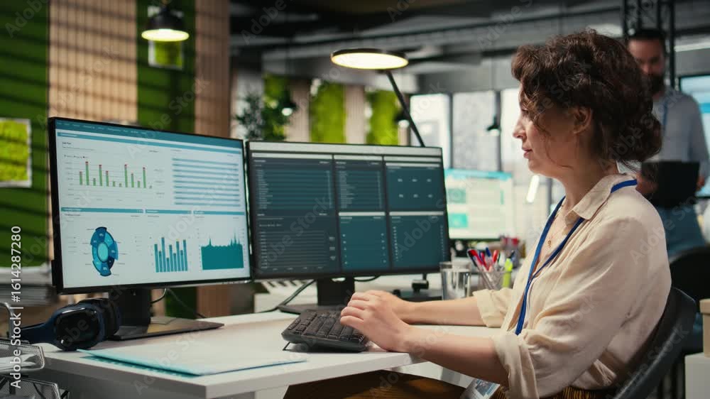 Poster administrator engages with financial data insights on a computer, developing innovative business sol