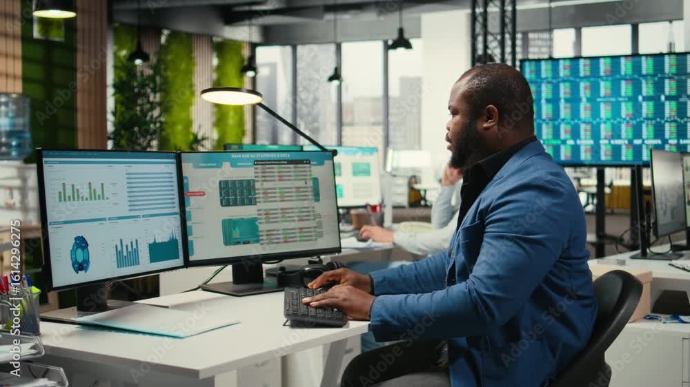 Poster african american consultant engaged in planning and analysis with computer results to create strateg