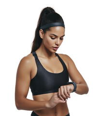 Hispanic female fitness athlete checking smartwatch while wearing black sportswear isolated on transparent background for digital health and exercise concept. 
