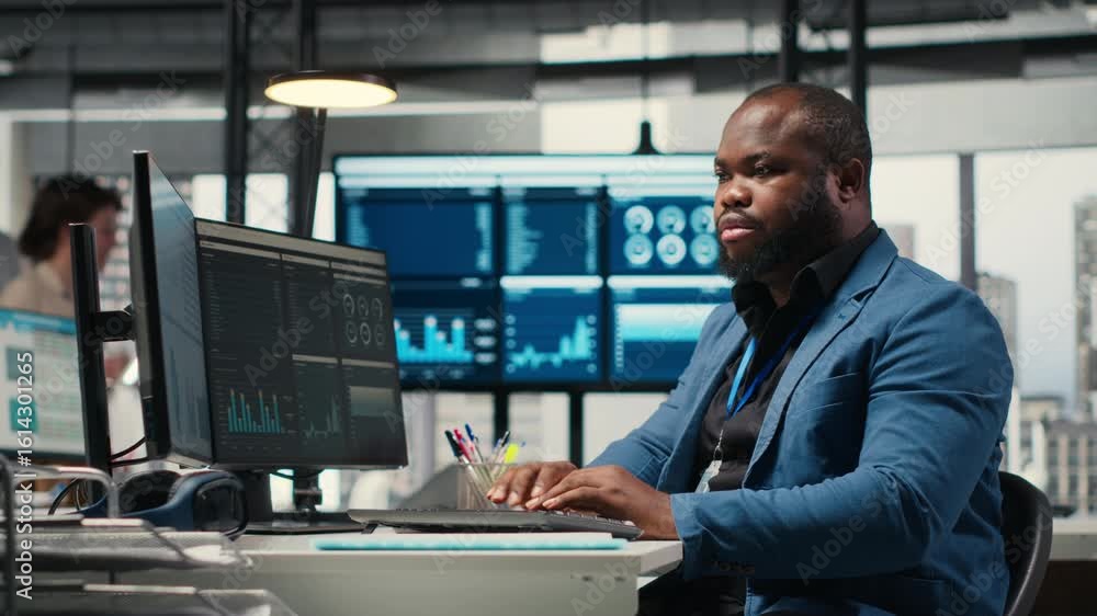 Poster african american male analyzing financial data forecast on a computer, developing innovative busines