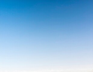 Clear, bright blue sky with a soft gradient