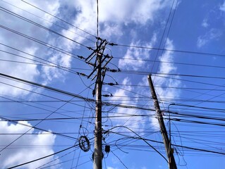 high voltage power lines whit blu sky background 