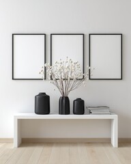 Minimalist living room display with black frames and vases