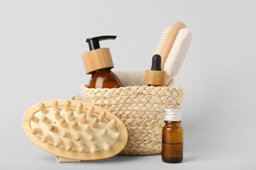 Composition with natural cosmetic products in wicker basket on white  background, closeup