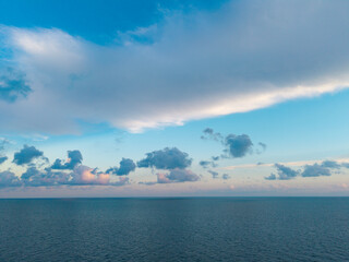 Obraz premium Calm horizon at sea. Romantic summer vacation seascape. Seascape horizon paradise. Sea sunrise on ocean beach. Sunset seascape at summer vacation. Horizon with sea cloudy sky. Relax on beach