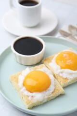 Tasty kaya toasts with half-boiled eggs served on table, closeup. Traditional asian breakfast