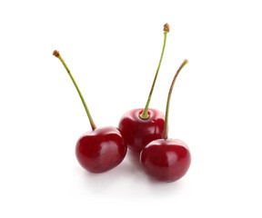 Three fresh ripe cherries isolated on white