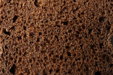 Fresh rye bread as background, closeup view