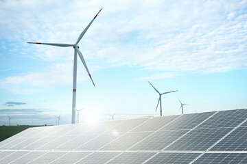 Solar panels and wind turbines outdoors. Alternative energy source