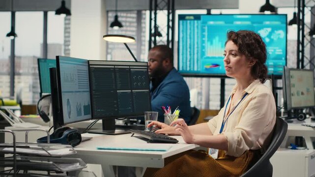 Female business analyst leverages insights and report writing for forecast results and corporate development, utilizing financial data charts for strategic alignment with objectives. Camera B.