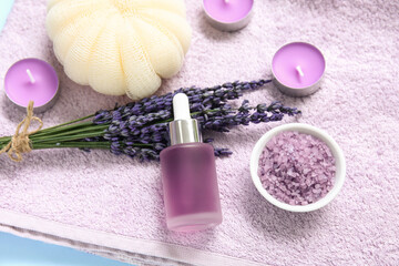 Plakat Beautiful composition with towel, sea salt, lavender flowers and bath sponge on lilac background, closeup