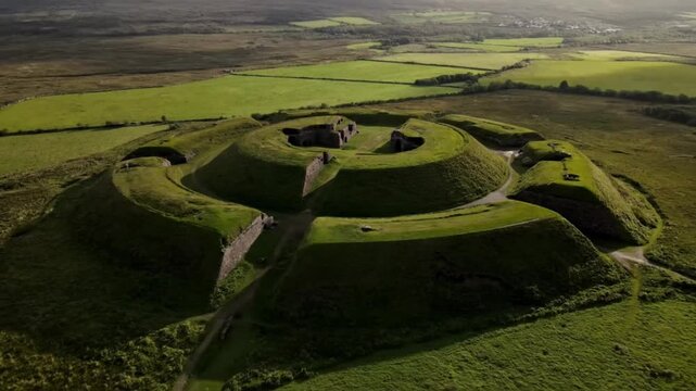 The ancient earthworks of navan fort in ireland stand as a testament to the celtic iron age, nestled amidst the rolling green hills and fields of the irish countryside
