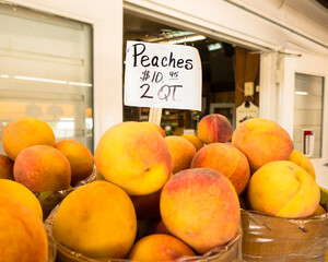 Fresh peaches in baskets at orchard stand