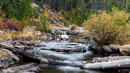 Cascade of running water at Provo river basin nature in Utah during autumn time at Uinta Wasatch National forest.