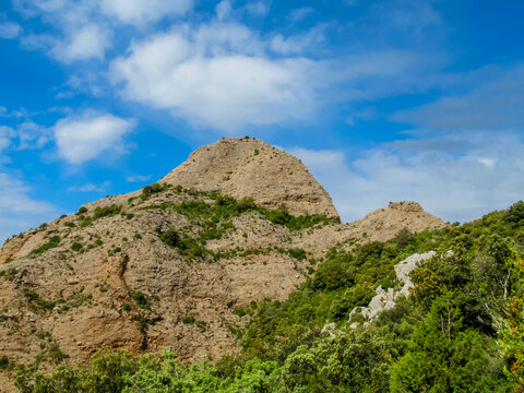 Mallos de Riglos Spain: united vertical red conglomerate cliffs and rock towers rise dramatically, attracting climbers and photographers to capture unique geological formations and natural landscapes