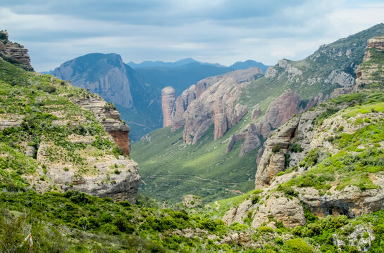 Mallos de Riglos Spain: united vertical red conglomerate cliffs and rock towers rise dramatically, attracting climbers and photographers to capture unique geological formations and natural landscapes