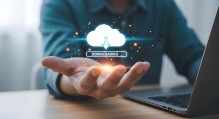 Hand holding digital cloud downloading data with glowing particles and laptop image