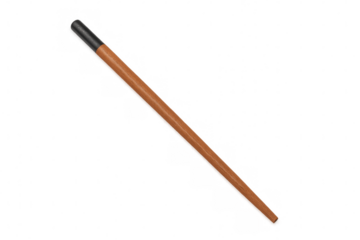 Wooden calligraphy pen with black tip resting diagonally, showcasing sophisticated writing instrument against transparent surface