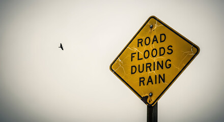 Essential Road Flood Warning Sign: Safety Alert for Drivers During Rain