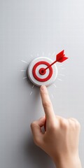 Hand Reaching for Target with Arrow Hitting Center on Gray Background