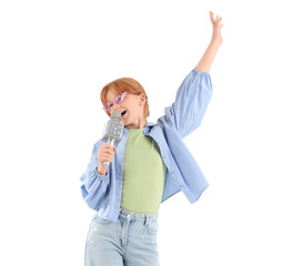 Teenage redhead girl in sunglasses with microphone singing karaoke on white background