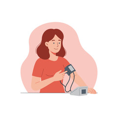 A woman measures her blood pressure with a blood pressure monitor